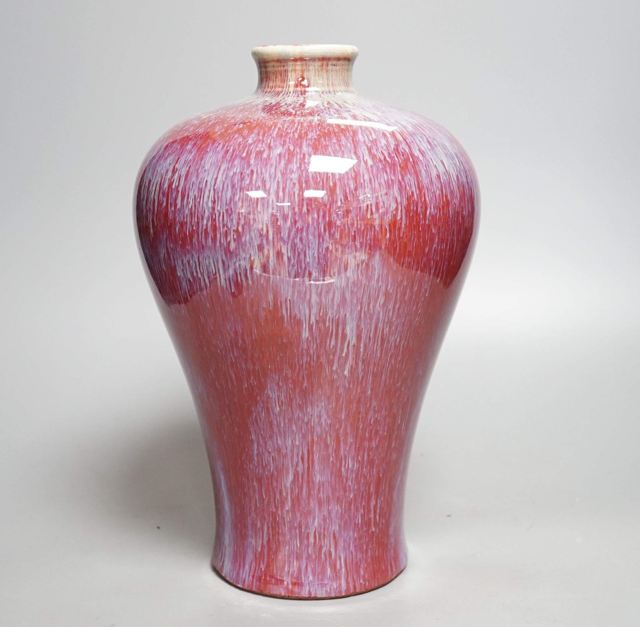 A sang-de-boeuf baluster vase, 30cm